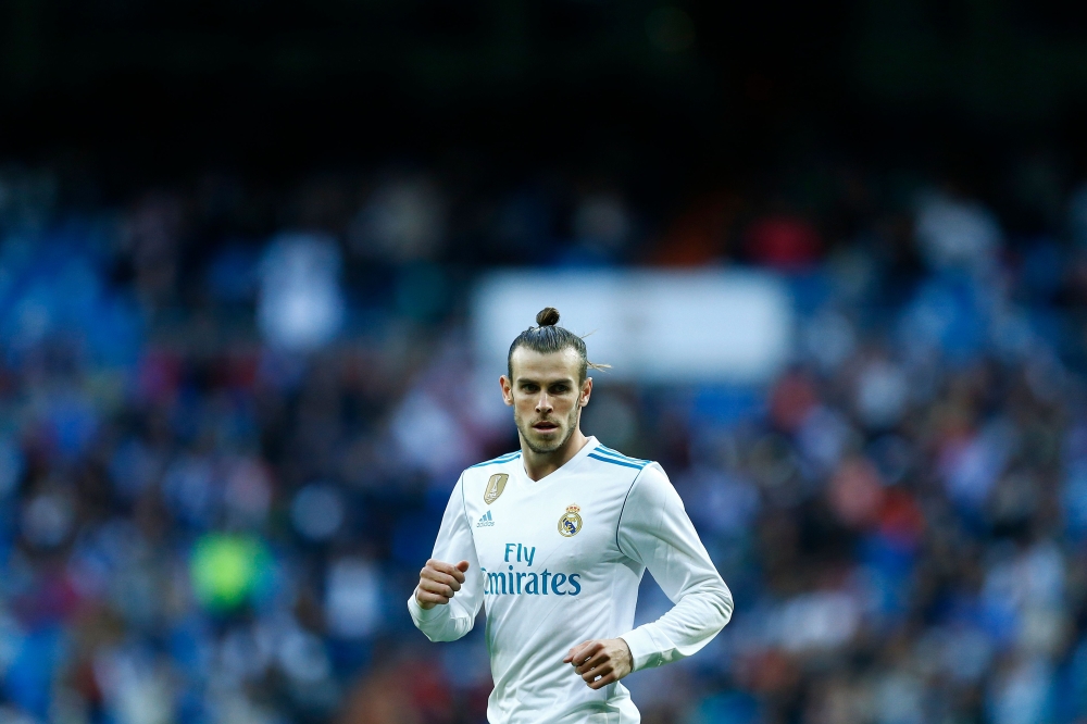 Real Madrid's Welsh forward Gareth Bale runs during the Spanish league football match between Real Madrid and Celta Vigo at the Santiago Bernabeu Stadium in Madrid on May 12, 2018. / AFP / Benjamin Cremel 