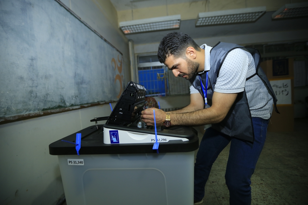 Iraqi polling station staff is seen after polls closed for the Iraqi parliamentary election in Baghdad, Iraq on May 12, 2018. Murtadha Sudani - Anadolu
