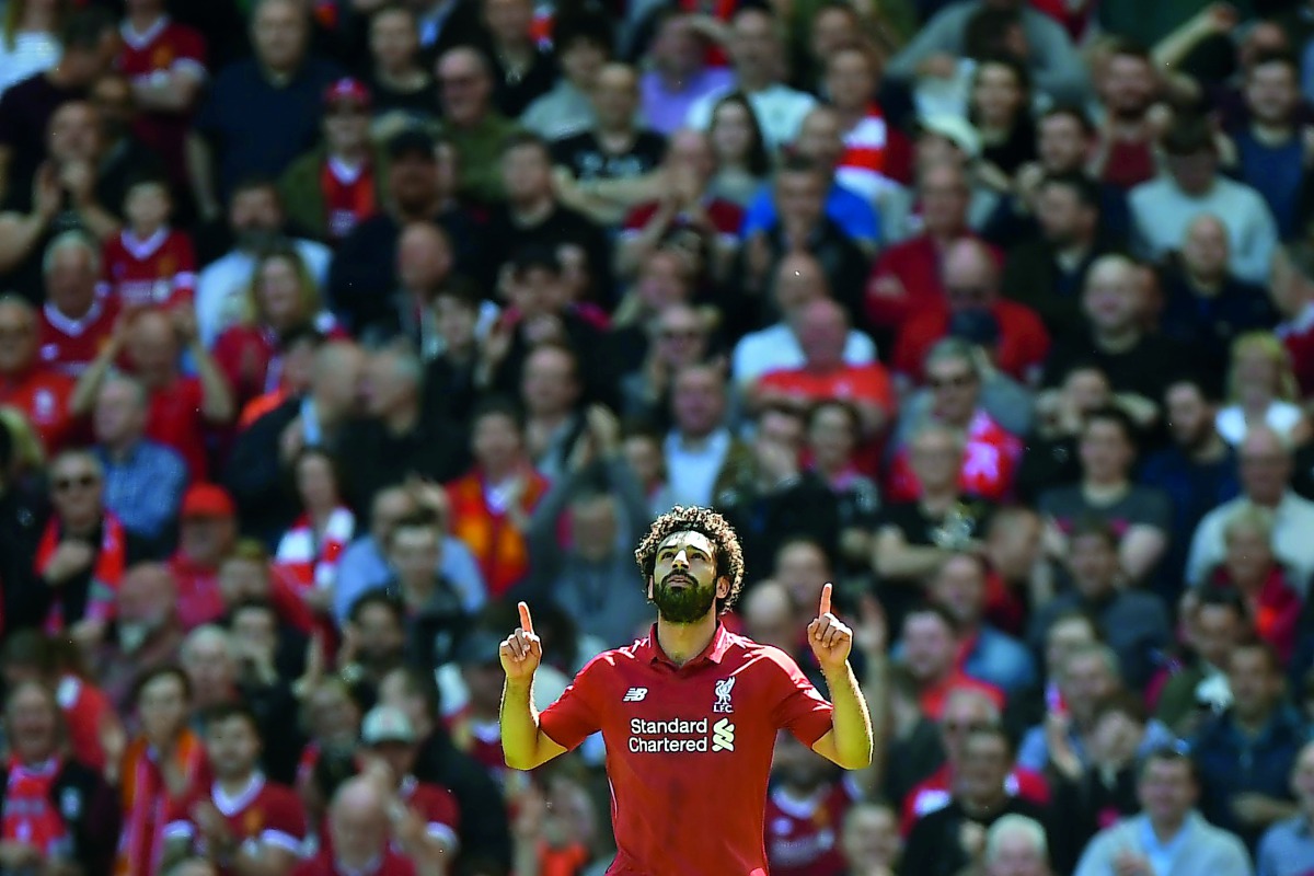 Liverpool's Egyptian midfielder Mohamed Salah celebrates after scoring during the English Premier League football match between Liverpool and Brighton and Hove Albion at Anfield in Liverpool, north west England on May 13, 2018. AFP / Paul Ellis