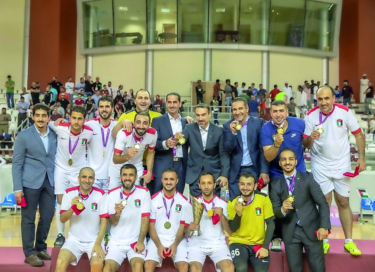 The Jordanian players and officials pose for a group photo. 