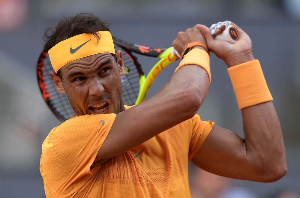 Spain's Rafael Nadal plays against Austria's Dominic Thiem during their ATP Madrid Open quarter-final tennis match at the Caja Magica in Madrid on May 11, 2018. / AFP / OSCAR DEL POZO