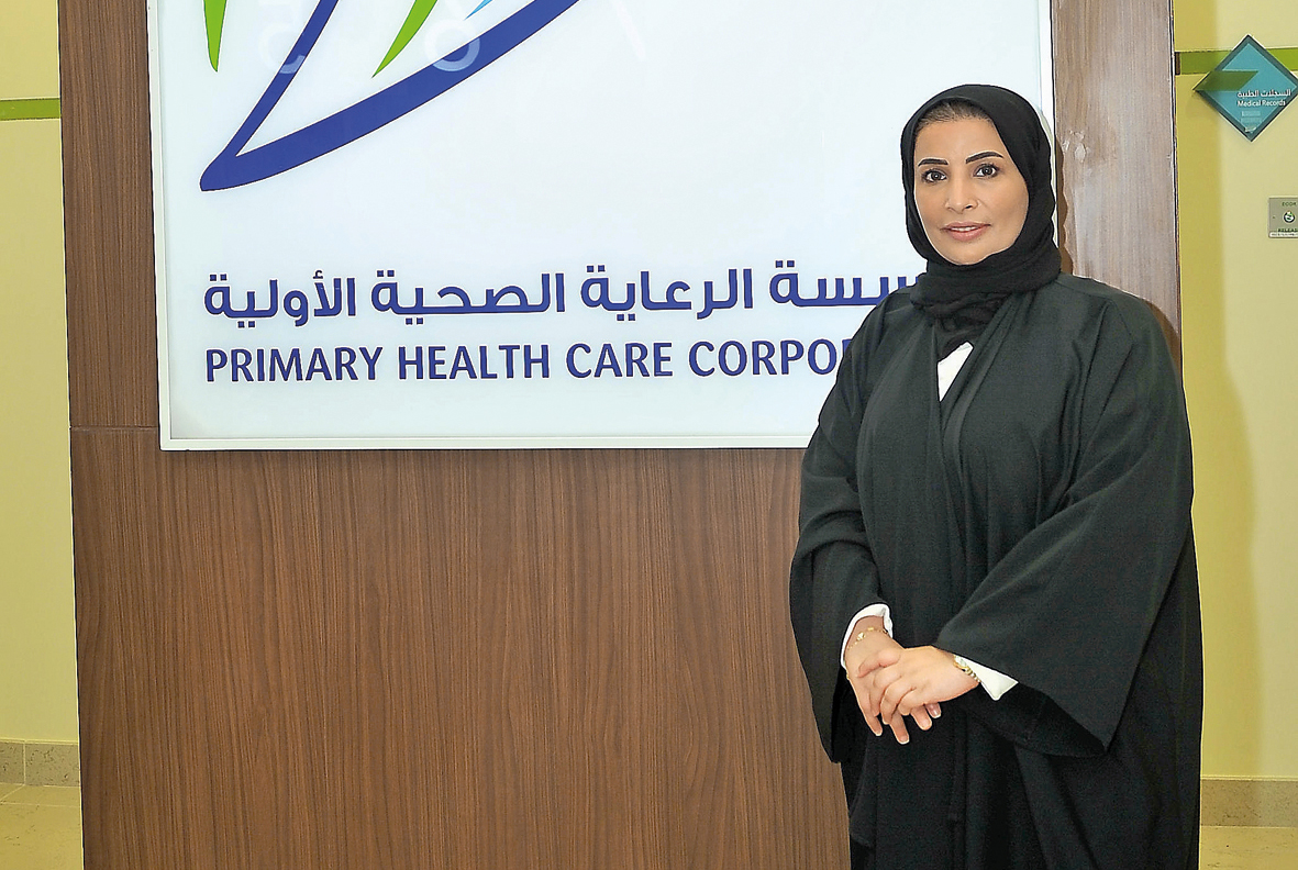 The gym at the Muaither Health and Wellness Centre and the Manager of the Centre, Dr. Sahar Salem Al Marri. Pic: Baher Amin / The Peninsula