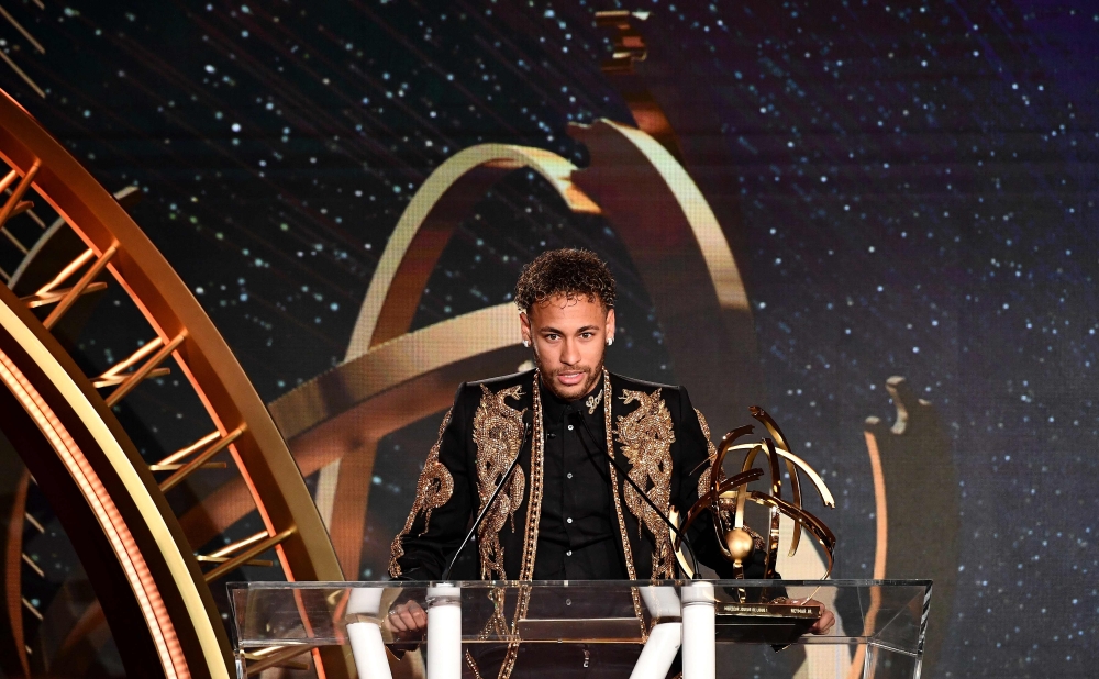 Paris Saint-Germain's Brazilian forward Neymar speaks as he receives the Best Ligue 1 Player award during a TV show on May 13, 2018 in Paris, as part of the 27th edition of the UNFP (French National Professional Football players Union) trophy ceremony. AF