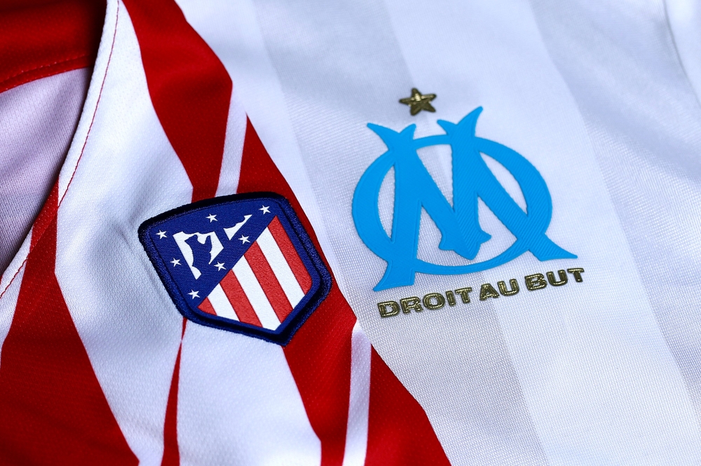 An illustration shows jerseys of Atletico Madrid and Marseille in Madrid on May 15, 2018. Atletico Madrid and Marseille prepare to meet in the Europa League final in Lyon on May 16, 2018. / AFP / Benjamin CREMEL