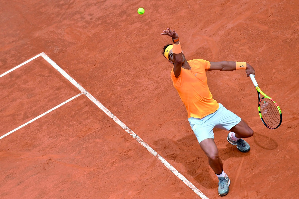 Spain's Rafael Nadal serves against Bosnia Herzegovina's Damir Dzumhur during Rome's ATP Tennis Open tournament at the Foro Italico, on May 16, 2018 in Rome.  AFP / Andreas Solaro