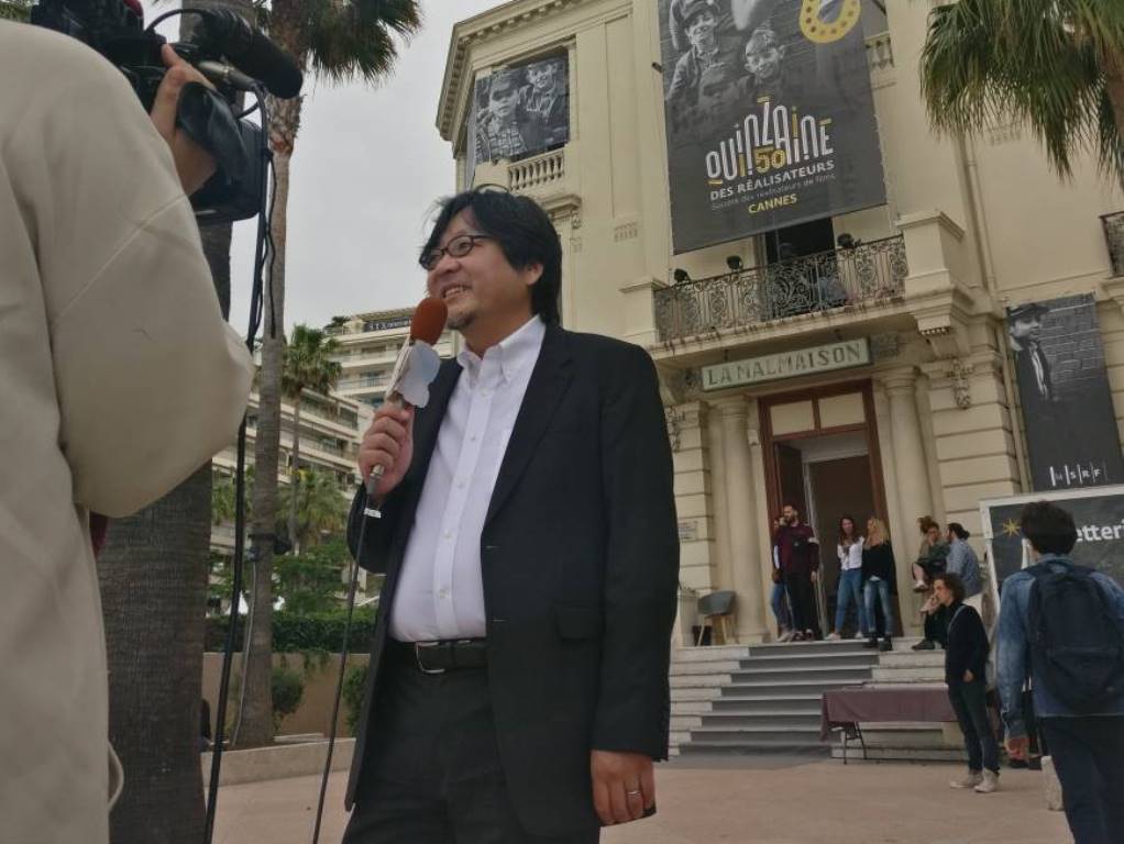 Mamoru Hosoda being interviewed at Cannes. Twitter 