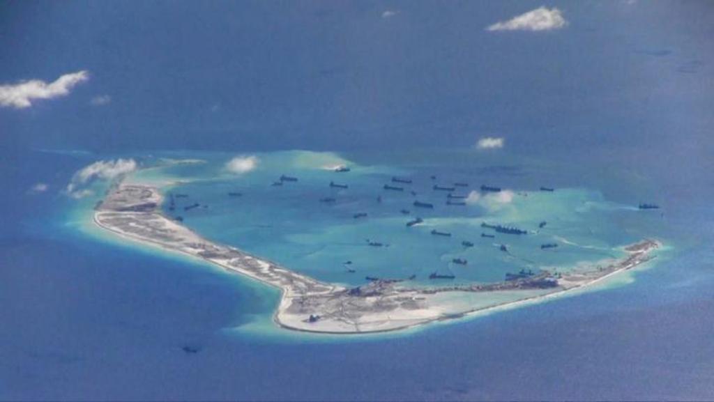 File photo of Chinese dredging vessels purportedly seen in the waters around Mischief Reef in the disputed Spratly Islands in the South China Sea in this still image from video taken by a P-8A Poseidon surveillance aircraft provided by the United States N
