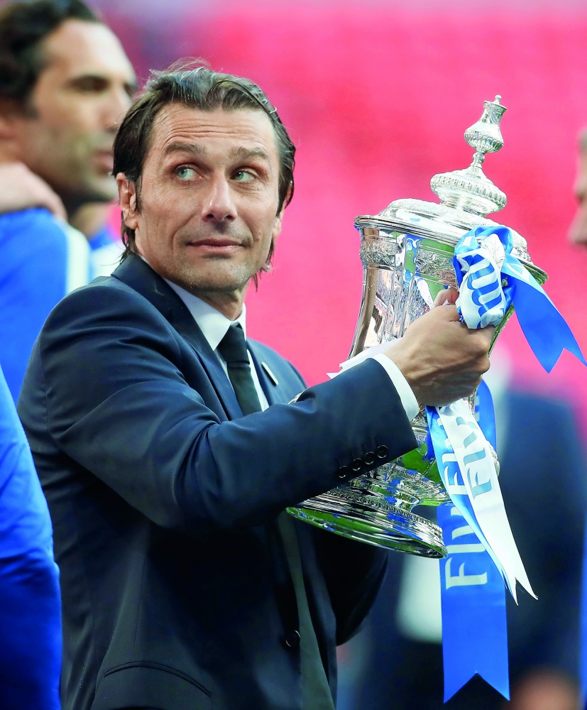 It was the first time since 2014 under Antonio Conte that Juventus's players got to celebrate their title with their fans in the streets of Turin where they were greeted by thousands of their supporters. In this photo, Chelsea manager Antonio Conte celebr