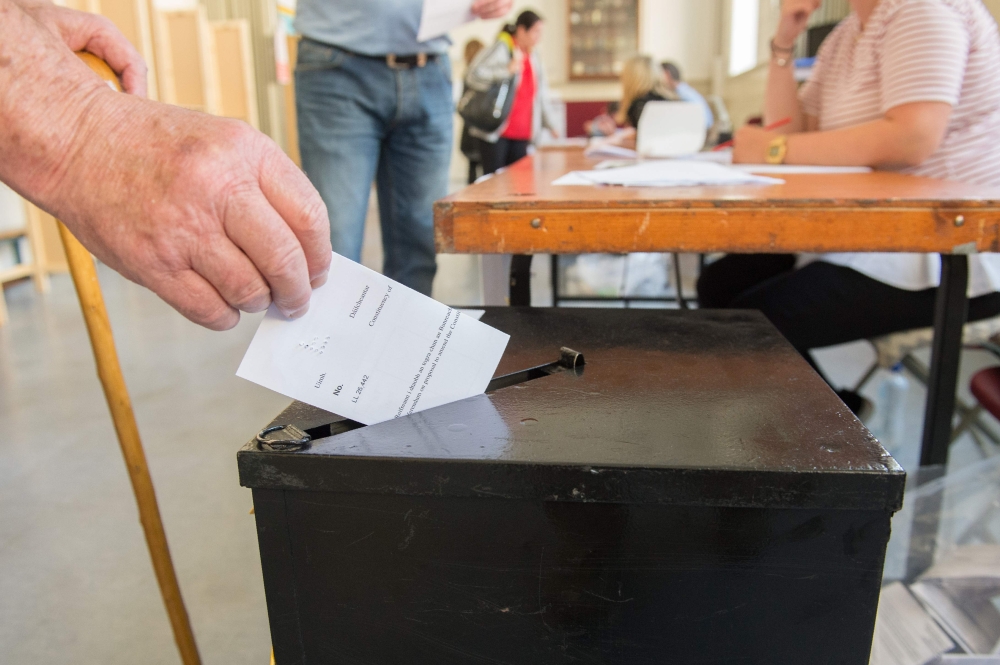 A voter casts her vote at the Marlborough Street National School polling station in Dublin, Ireland on May 25, 2018, during the Irish referendum on liberalising the abortion law. / AFP / BARRY CRONIN 