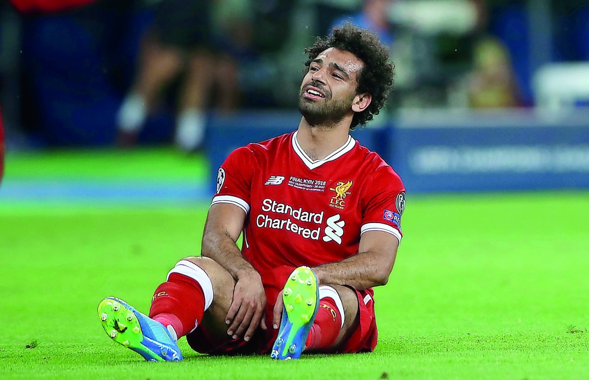 Liverpool's Mohamed Salah looks dejected after injury. Reuters/Hannah McKay