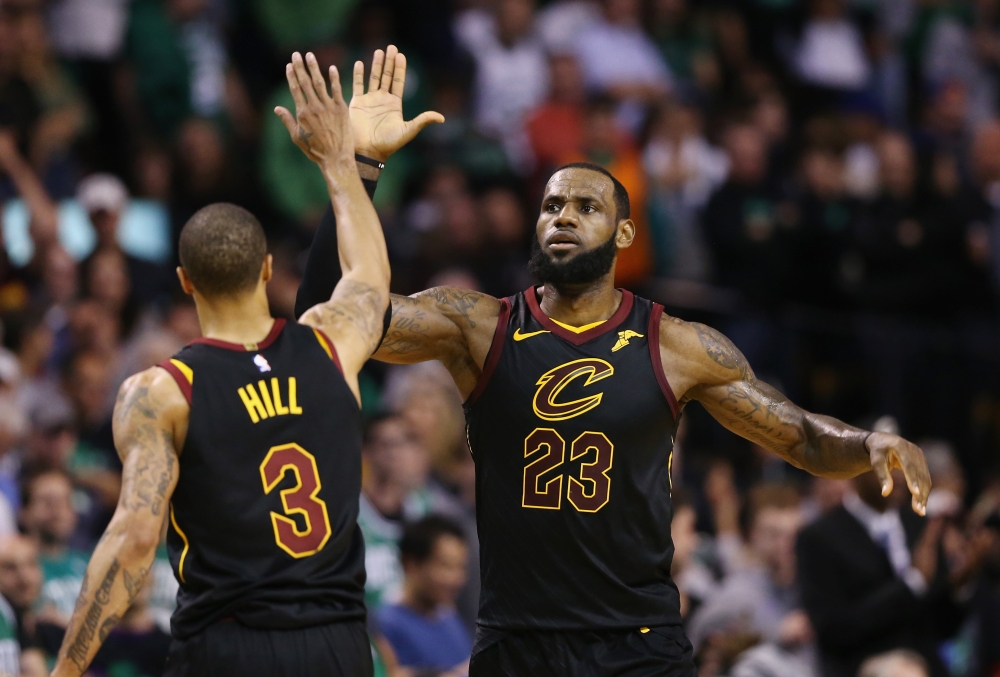 BOSTON: LeBron James #23 of the Cleveland Cavaliers celebrates with George Hill #3 in the second half against the Boston Celtics during Game Seven of the 2018 NBA Eastern Conference Finals at TD Garden on May 27, 2018 in Boston, Massachusetts. Maddie Meye