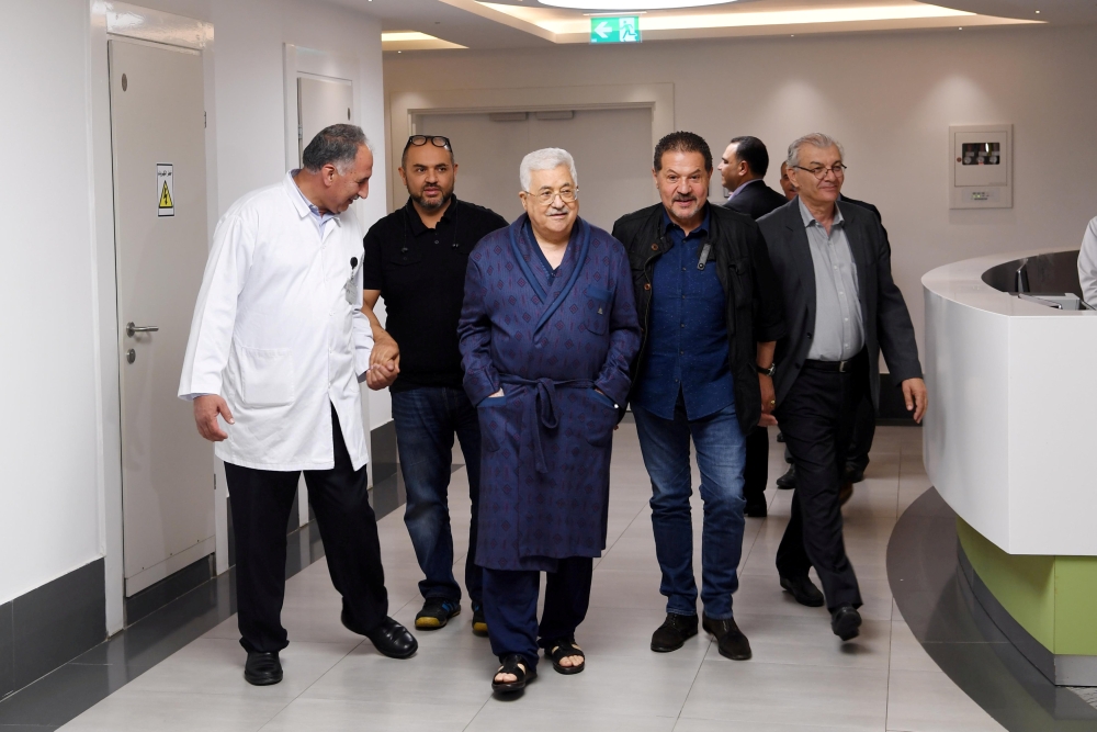FILE PHOTO: Palestinian President Mahmoud Abbas walks inside the hospital in Ramallah, in the occupied West Bank May 21, 2018. Palestinian President Office (PPO)/Handout via REUTERS/File Photo