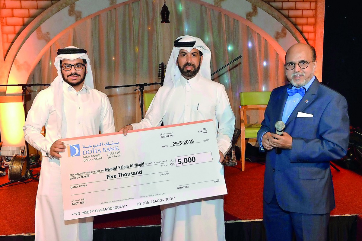 Dr R Seetharaman (right), CEO of Doha Bank and Rashid Al Mansoori (centre), CEO, Qatar Exchange; with one of the winners of Doha Bank’s Al Dana programme during the special Suhoor banquet hosted for the bank’s corporate clients and customers at the Fawane