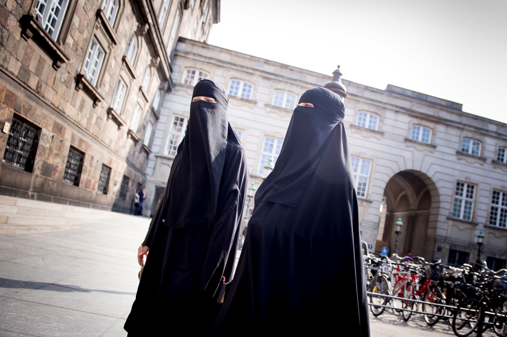 Women in niqab are pictured after the Danish Parliament banned the wearing of face veils in public, at Christiansborg Palace in Copenhagen, Denmark, May 31, 2018. (Ritzau Scanpix/Mads Claus Rasmussen/via REUTERS) 