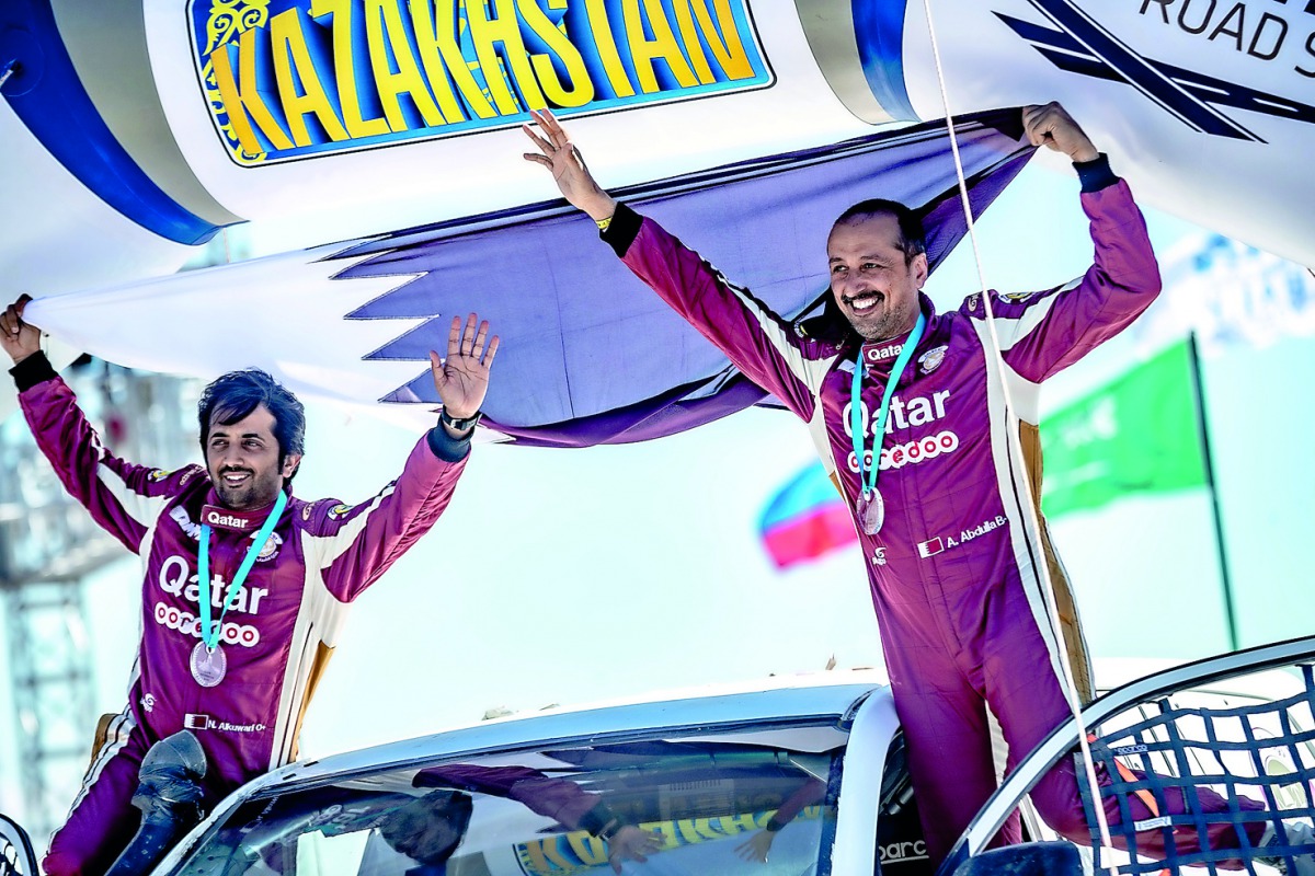 Qatar’s Adel Abdulla (right) and Nasser Al Kuwari celebrate their third place finish.