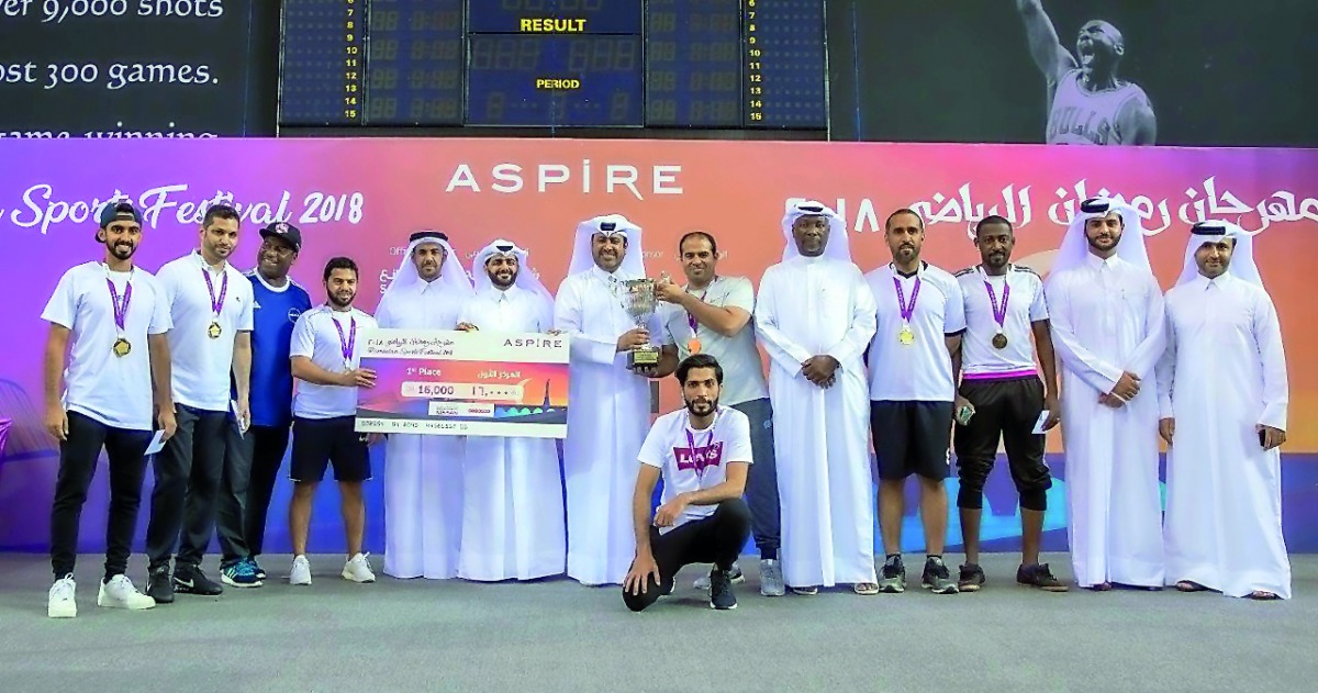 The winners pose with officials of Aspire Zone Foundation at the 7th edition of Ramadan Sports Festival closing ceremony.