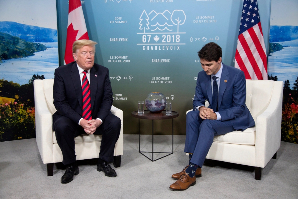 Canada's Prime Minister Justin Trudeau (R) meets with U.S. President Donald Trump during the G7 Summit in the Charlevoix town of La Malbaie, Quebec, Canada, June 8, 2018. (REUTERS/Christinne Muschi)