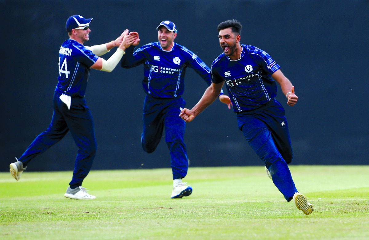 Scotland's Safyaan Sharif celebrates winning the match. Action Images via Reuters/Craig Brough
