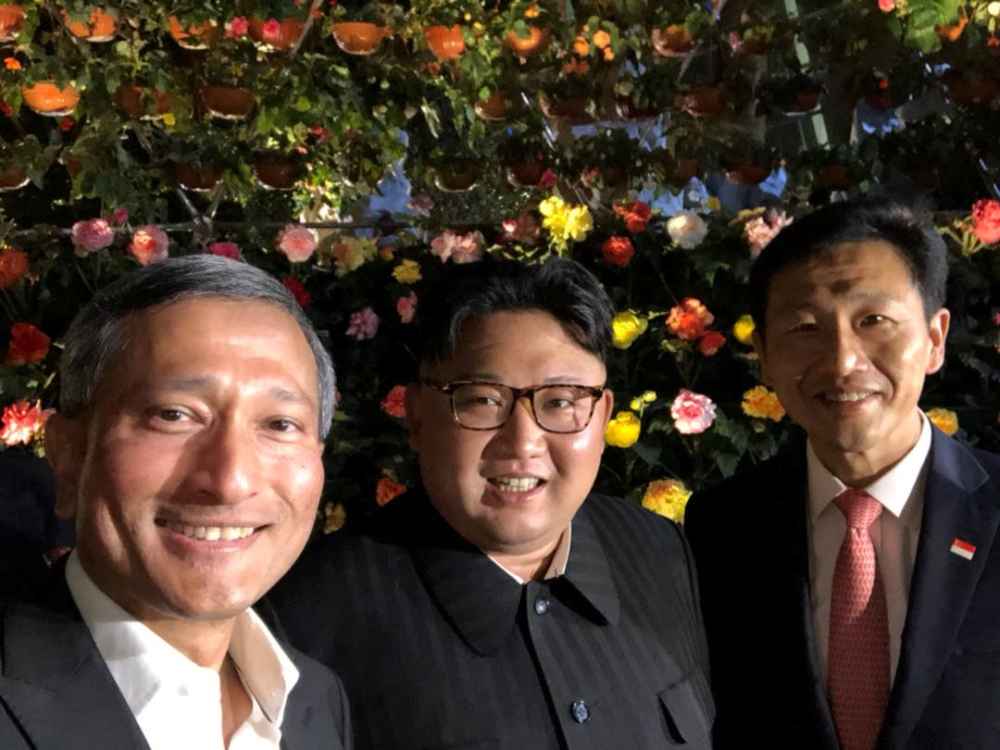 Singapore's Finance Minister Vivian Balakrishnan, North Korean leader Kim Jong Un, and Singapore's Education Minister Ong Ye Kung pose for a photo in Singapore June 11, 2018, in this photo obtained from social media. (Vivian Balakrishnan's Twitter page/vi