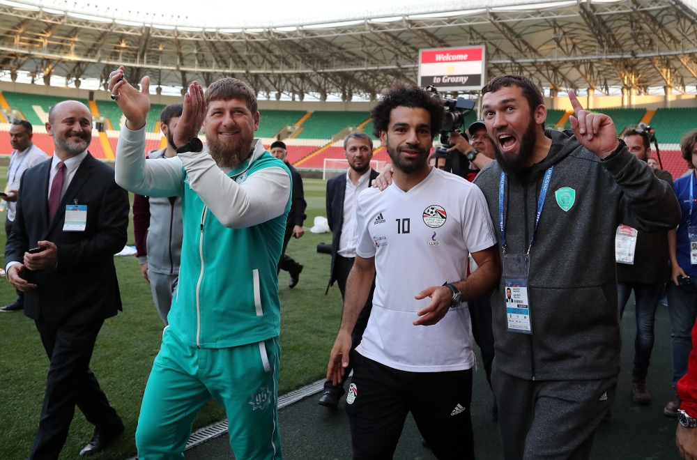 Egyptian national team football player and Liverpool's star striker Mohamed Salah (2ndR) and head of the Chechen Republic Ramzan Kadyrov (2ndL) pose during a training of Egyptian team at the Akhmat Arena stadium in Grozny on June 10, 2018, ahead of the Ru