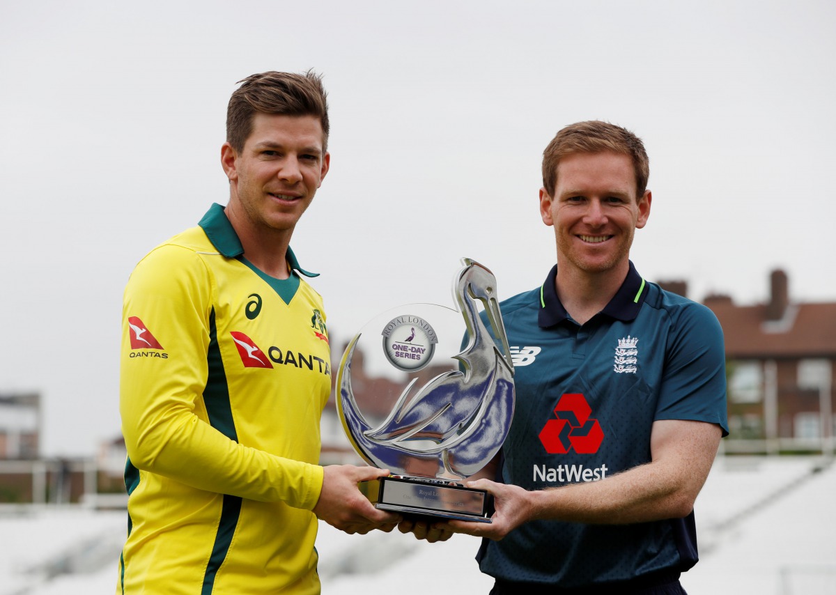 Australia's Tim Paine and England's Eoin Morgan pose with the trophy Action Images via Reuters/Paul Childs
