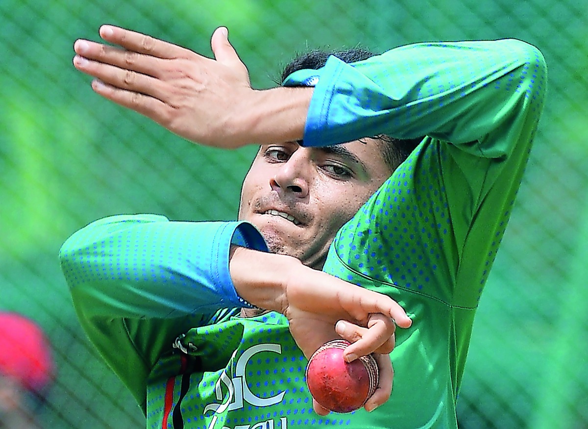 Afghanistan spinner Mujeeb-Ur-Rahman bowls in the nets during a practice session at the M. Chinnaswamy Stadium in Bangalore on June 12, 2018. AFP / Manjunath Kiran