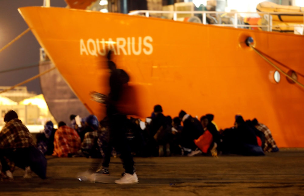 Migrants disembark from the MV Aquarius a search and rescue ship run in partnership between SOS Mediterranee and Medecins Sans Frontieres on the island of Sicily January 30 2018 Reuters Antonio Parrinello