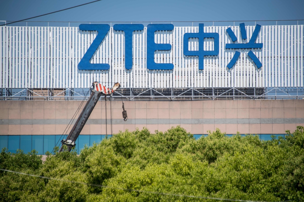 This file photo taken on May 3, 2018 shows the ZTE logo on a building in Shanghai.  AFP / Johannes Eisele