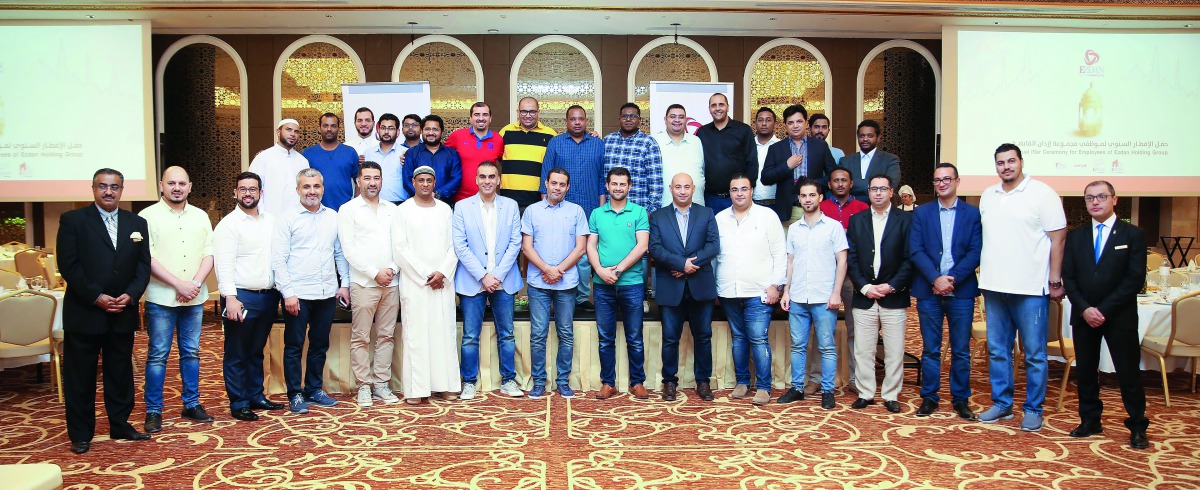 The staff of Ezdan Holding Group with officials during the Iftar gathering at Ezdan Palace Hotel. 