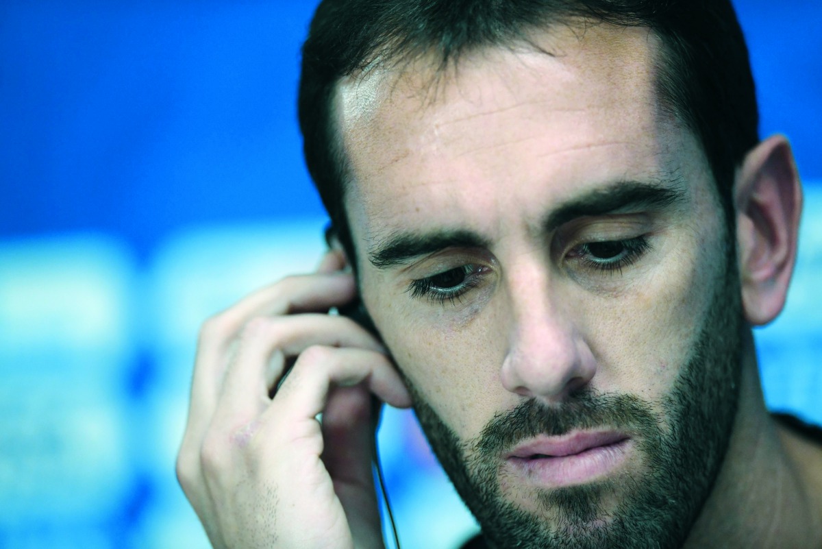 Uruguay's defender Diego Godin attends a press conference at Ekaterinburg Stadium in Ekaterinburg on June 14, 2018, a day ahead the team's Russia 2018 World Cup Group A opening football match against Egypt. AFP / Jorge Guerrero


