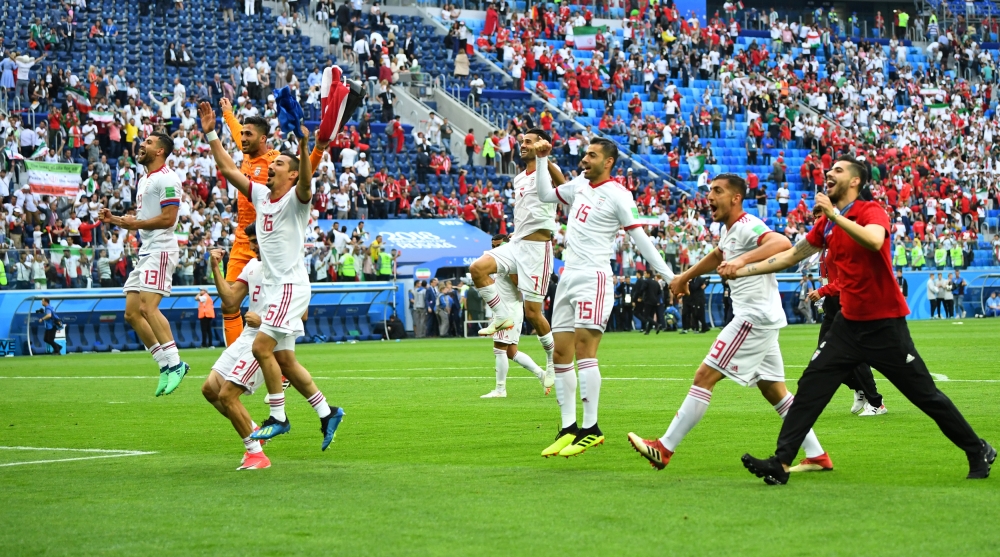 Iran's Reza Ghoochannejhad and team mates celebrate at the end of the match (REUTERS/Dylan Martinez)