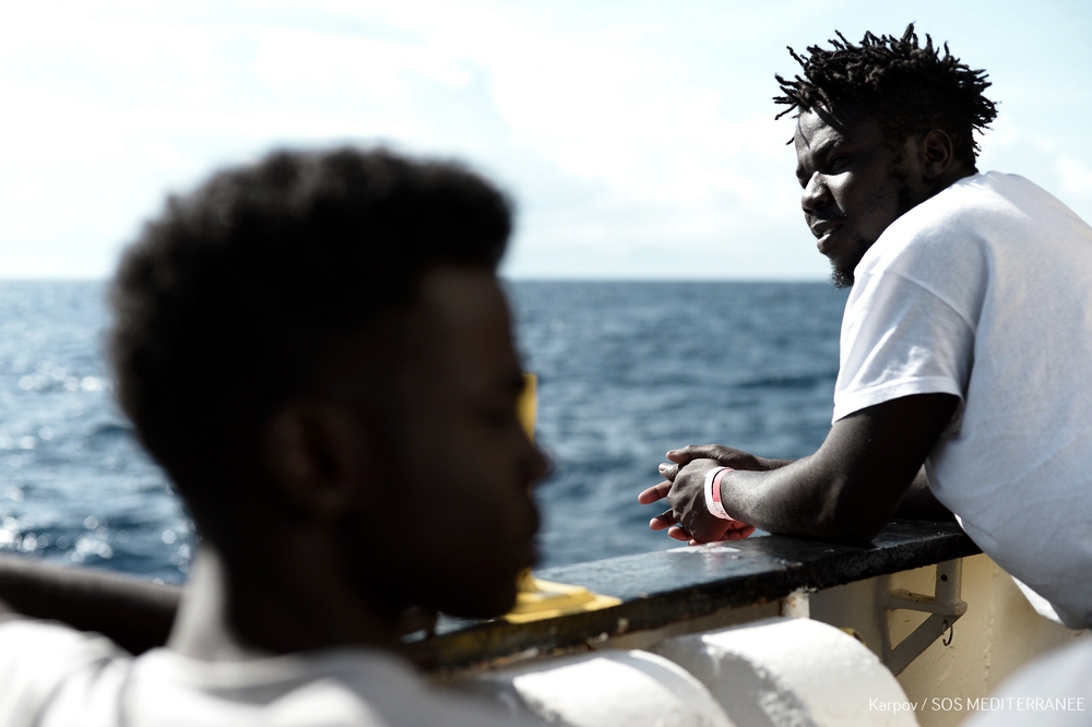 This handout picture obtained on June 15, 2018 from French non-governmental organisation Medecins Sans Frontieres - Doctors Without Borders (MSF) shows migrants onboard the MV Aquarius at sea on June 14, 2018. AFP PHOTO / MEDECINS SANS FRONTIERES 