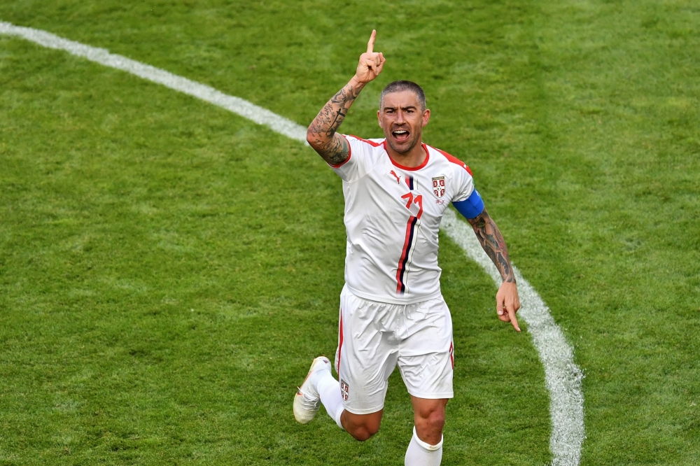 Serbia's defender Aleksandar Kolarov celebrates after scoring from a free-kick during the Russia 2018 World Cup Group E football match between Costa Rica and Serbia at the Samara Arena in Samara on June 17, 2018. AFP / Fabrice COFFRINI