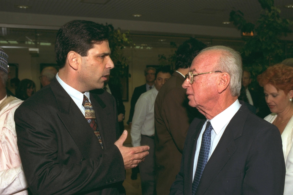 Former Israeli Prime Minister Yitzhak Rabin (R) speaks with former energy minister Gonen Segev during a conference in Jerusalem, in this file photo released by the Israeli Government Press Office (GPO), obtained by Reuters on June 18, 2018. REUTERS/GPO/Ha