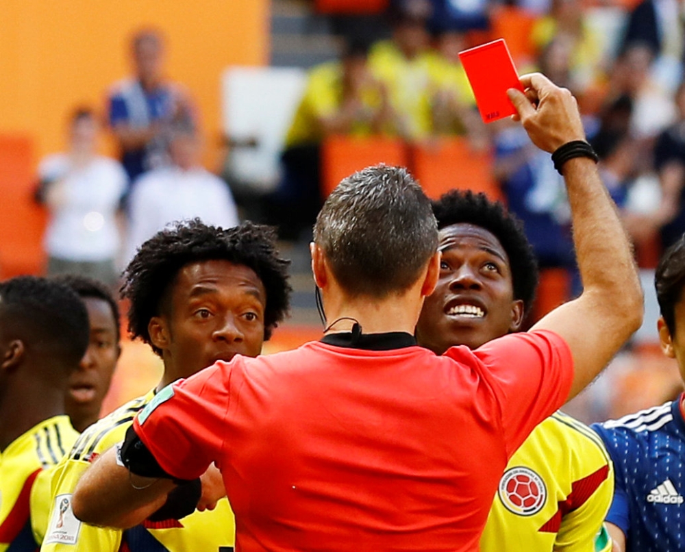 Colombia's Carlos Sanchez is sent off by referee Damir Skomina REUTERS/Jason Cairnduff
