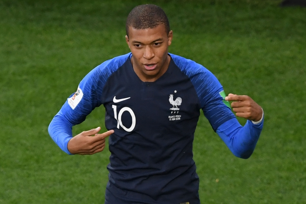 France's forward Kylian Mbappe celebrates his goal during the Russia 2018 World Cup Group C football match between France and Peru at the Ekaterinburg Arena in Ekaterinburg on June 21, 2018.  AFP / Jorge Guerrero