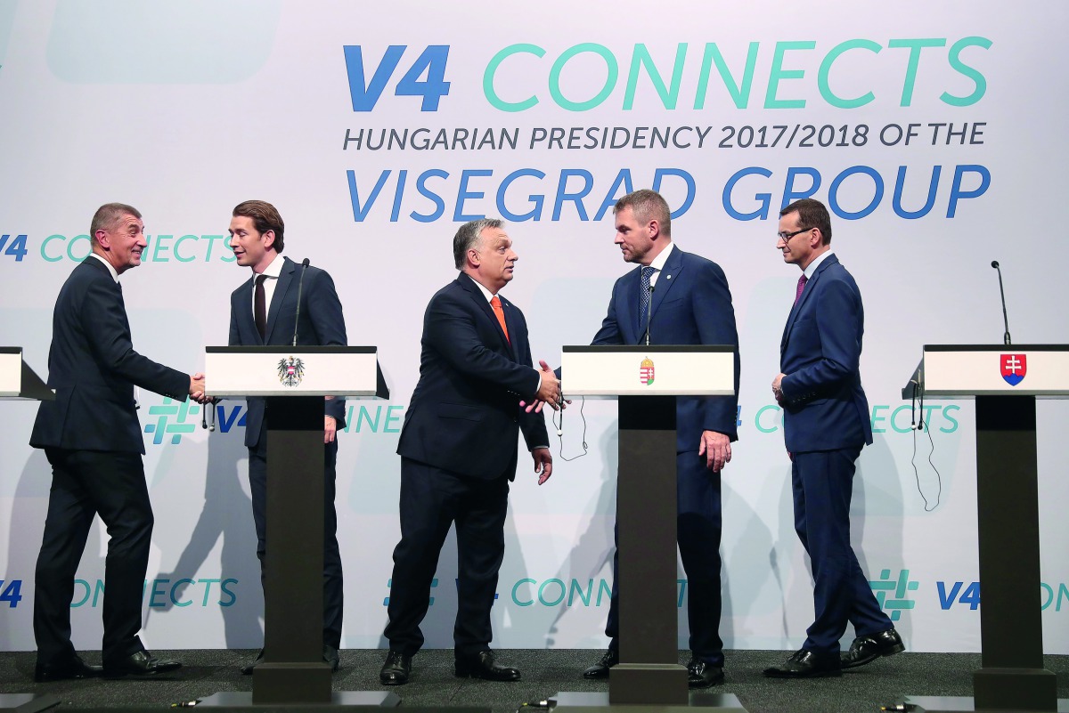 (L-R) Czech Prime Minister Andrej Babis, Austrian Chancellor Sebastian Kurz, Hungarian Prime Minister Viktor Orban, Slovakia's Prime Minister Peter Pellegrini and Polish Prime Minister Mateusz Morawiecki shake hands during a press conference at a meeting 
