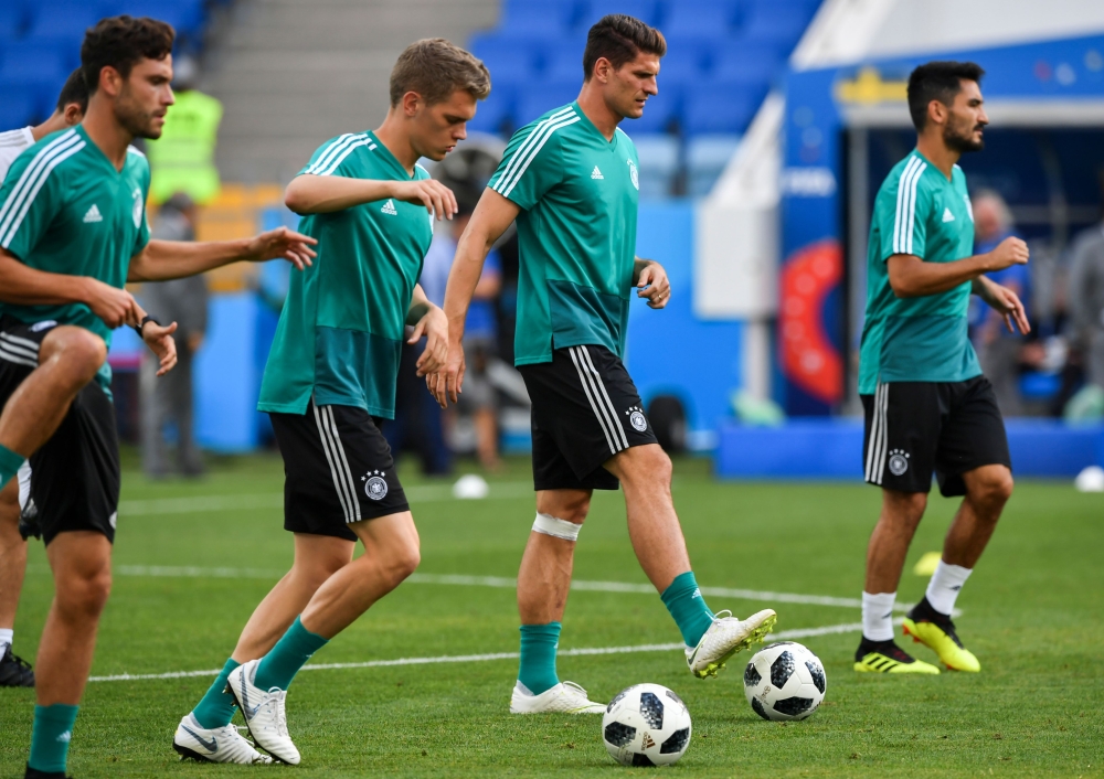L to R, Germany's defender Jonas Hector, Germany's defender Joshua Kimmich, Germany's forward Mario Gomezand Germany's midfielder Ilkay Gundogan attend a training session at the Fisht Olympic Stadium in Sochi on June 22, 2018, on the eve of the Russia 201