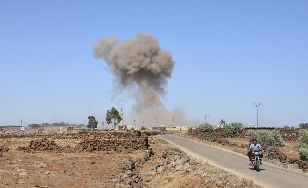 Smoke rises after Assad Regime forces carried out an attack in Syria's southwestern Daraa province on June 23, 2018. Ammar Al Ali - Anadolu
