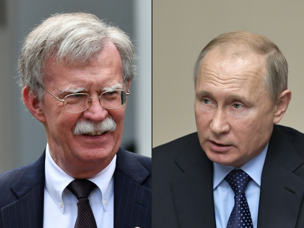 (COMBO) (L)US National Security advisor John Bolton, (R) Russian President Vladimir Putin. AFP / Sputnik / Nicholas KAMM AND Alexey NIKOLSKY