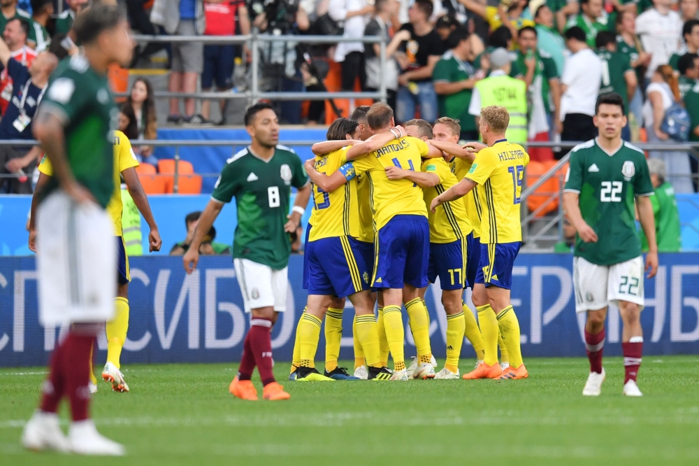 Sweden's players celebrate their victory after the Russia 2018 World Cup Group F football match between Mexico and Sweden at the Ekaterinburg Arena in Ekaterinburg on June 27, 2018. AFP / HECTOR RETAMAL