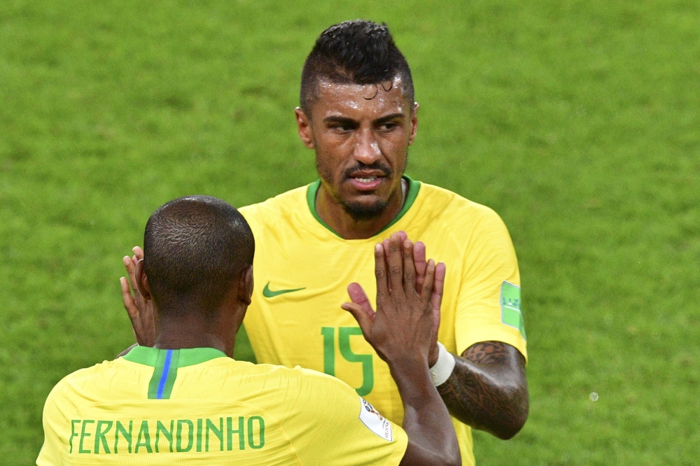 Brazil's midfielder Fernandinho replaces Brazil's midfielder Paulinho (back) during the Russia 2018 World Cup Group E football match between Serbia and Brazil at the Spartak Stadium in Moscow on June 27, 2018. AFP / Mladen Antonov