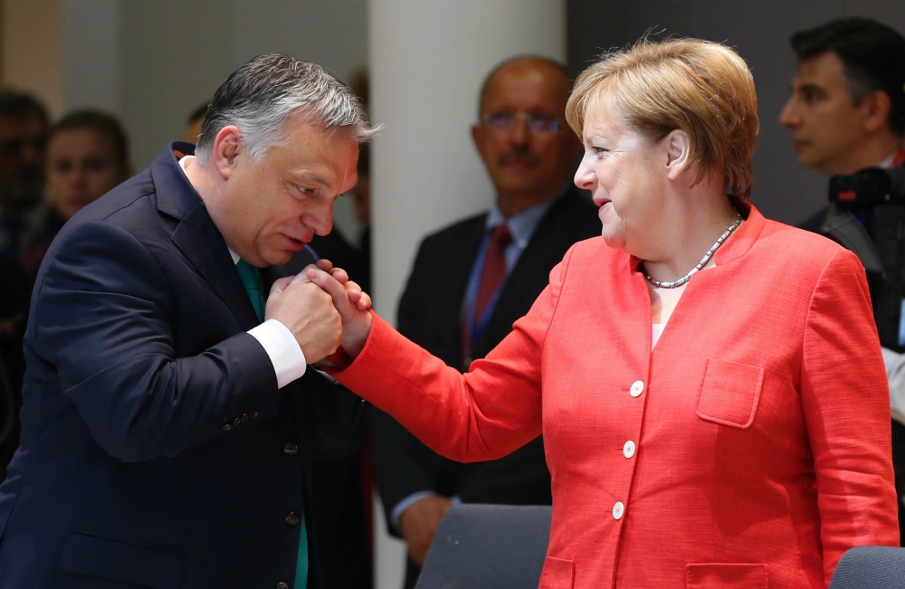 German Chancellor Angela Merkel (R) chats with Prime Minister of Hungary Viktor Orban (L) during the second day of the European Union Leaders' Summit in Brussels, Belgium on June 29, 2018. (Dursun Aydemir/Anadolu Agency)