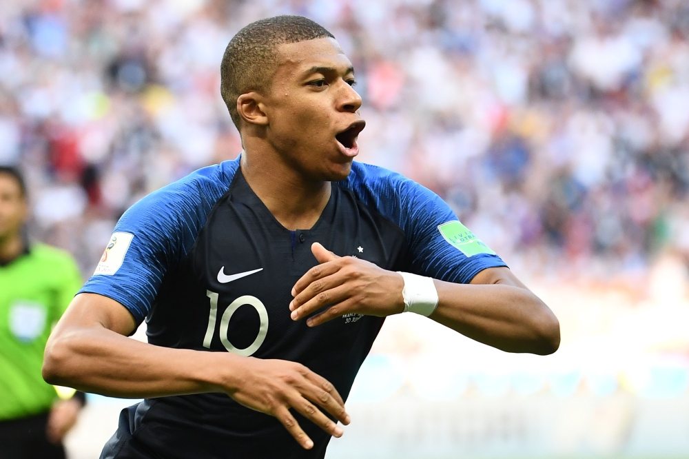 France's forward Kylian Mbappe celebrates after scoring their four goal during the Russia 2018 World Cup round of 16 football match between France and Argentina at the Kazan Arena in Kazan on June 30, 2018.  AFP / FRANCK FIFE
