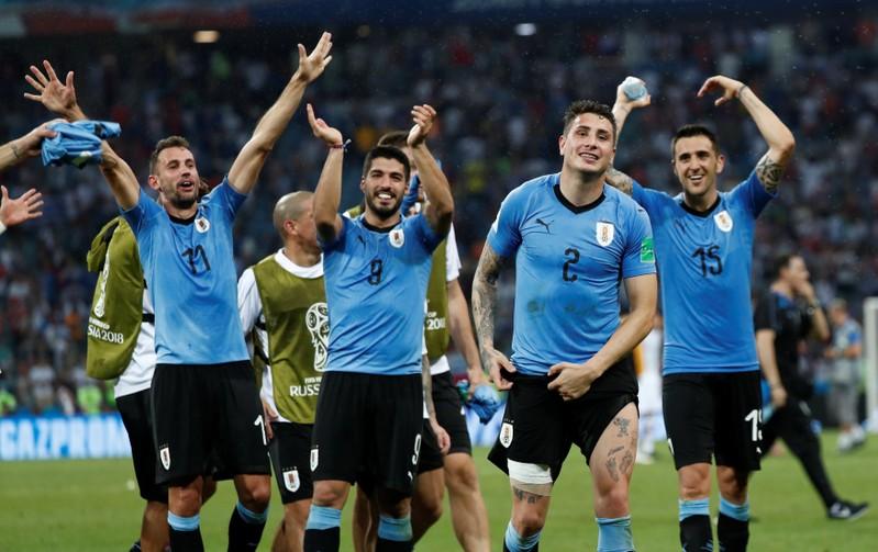 Soccer Football - World Cup - Round of 16 - Uruguay vs Portugal - Fisht Stadium, Sochi, Russia - June 30, 2018 Uruguay's Luis Suarez, Jose Gimenez and team mates celebrate after the match REUTERS/Murad Sezer