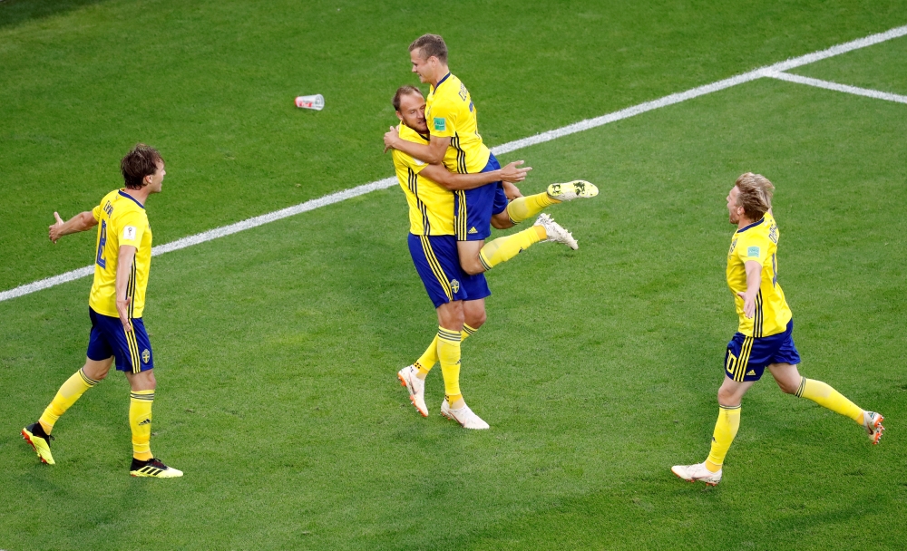 Sweden's Andreas Granqvist celebrates scoring their second goal from the penalty spot with team mates REUTERS/Damir Sagolj 