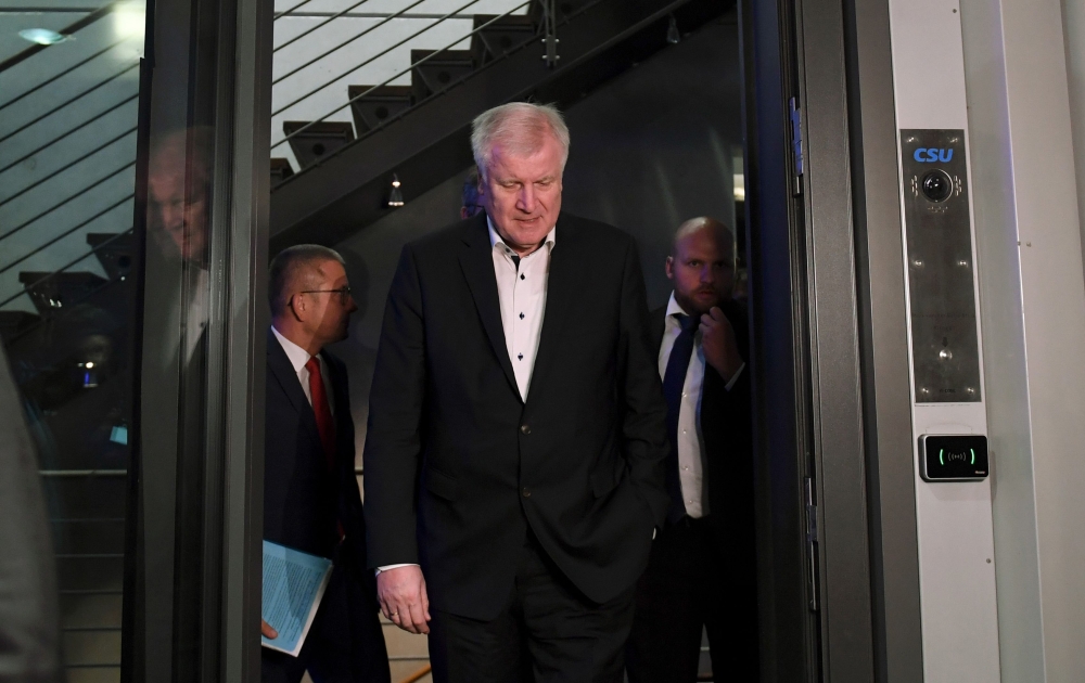 German Interior Minister and leader of the Christian Social Union (CSU) Party Horst Seehofer leaves after a party leadership meeting at the CDU headquarters in Berlin, on July 2, 2018. AFP / Christof Stache 
 