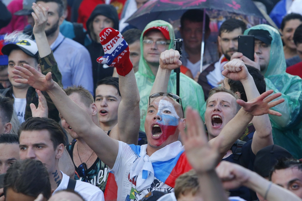Russian supporters react while watching the match in a fan zone. REUTERS/Sergei Karpukhin
