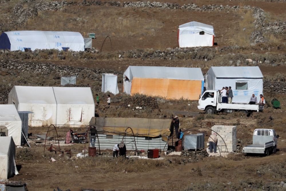 A general view of refugee tents erected in Syria seen from the Israeli-occupied Golan Heights, Israel July 1, 2018. REUTERS/Ammar Awad