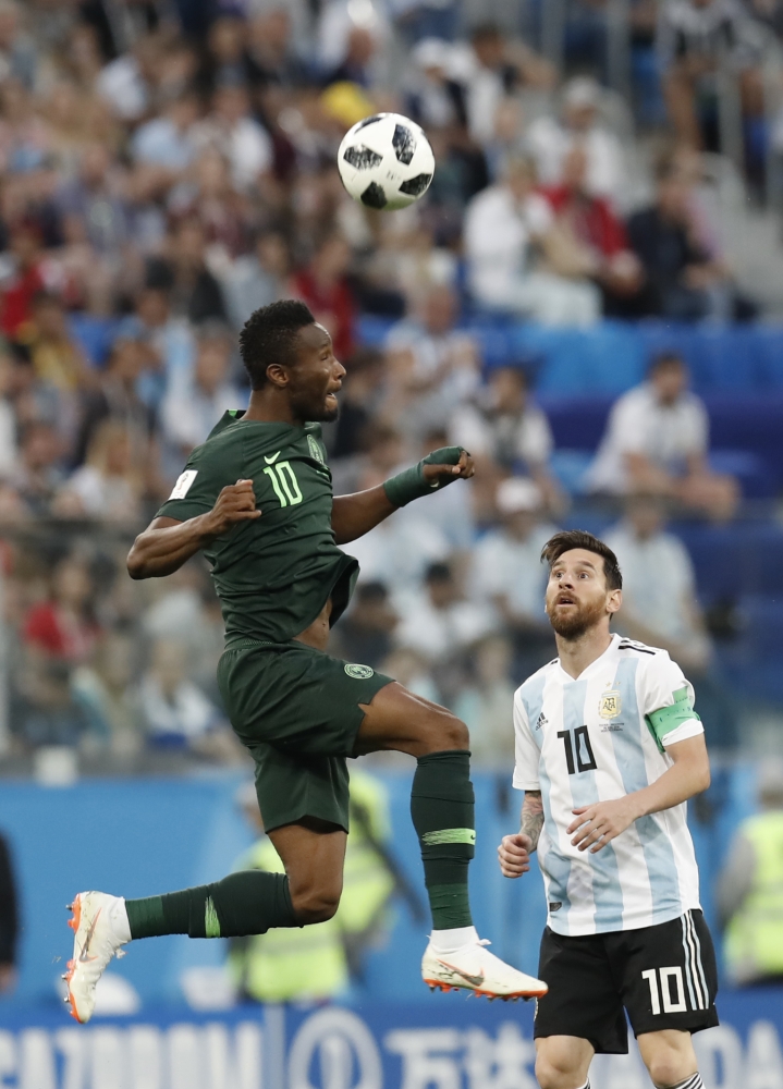 Lionel Messi (R) of Argentina in action against John Obi Mikel (L) of Nigeria during the 2018 FIFA World Cup Russia Group D match between Nigeria and Argentina at the Saint Petersburg Stadium in St. Petersburg, Russia on June 26, 2018. (Fatih Akta?/Anadol